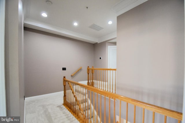 hall featuring baseboards, recessed lighting, ornamental molding, carpet flooring, and an upstairs landing