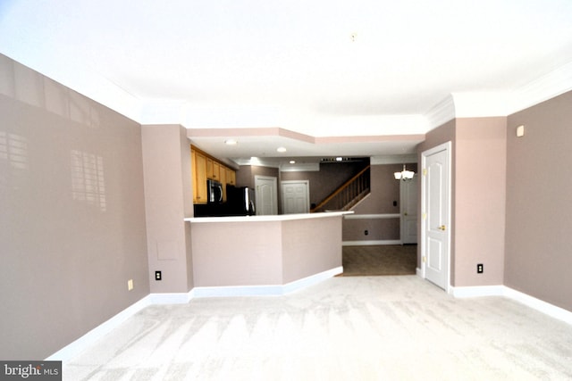 unfurnished living room with baseboards, recessed lighting, ornamental molding, stairs, and light carpet