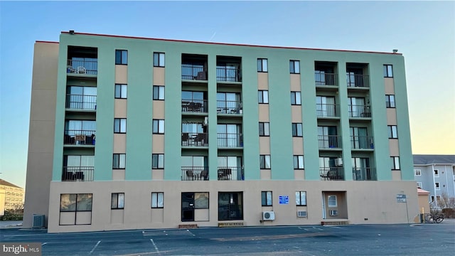 property at dusk with central air condition unit