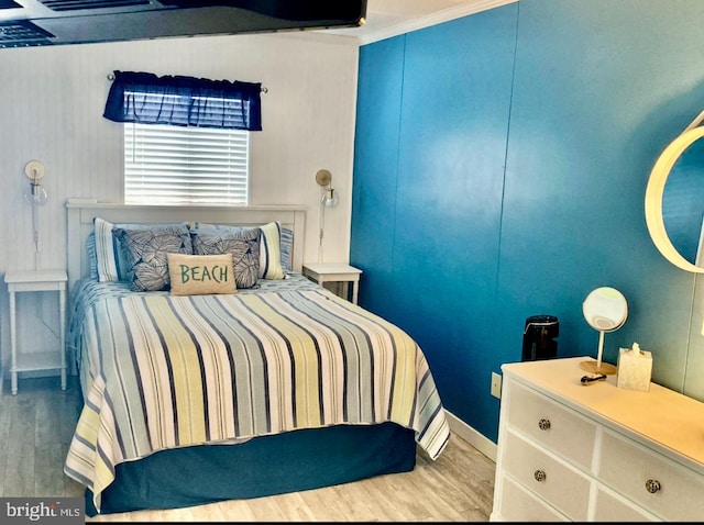 bedroom featuring wood finished floors