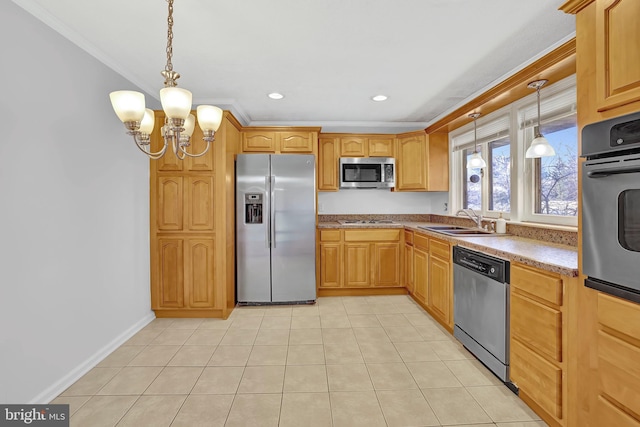 kitchen featuring crown molding, appliances with stainless steel finishes, an inviting chandelier, hanging light fixtures, and a sink