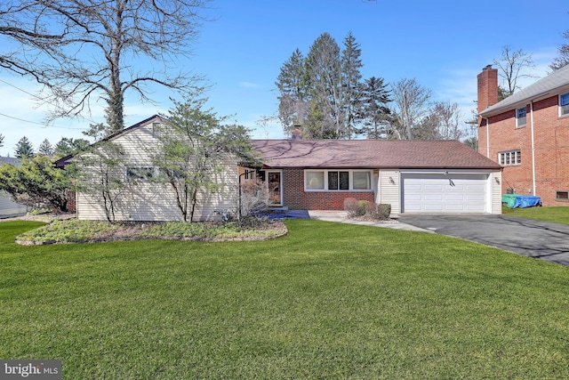 single story home featuring a chimney, driveway, a front yard, and a garage