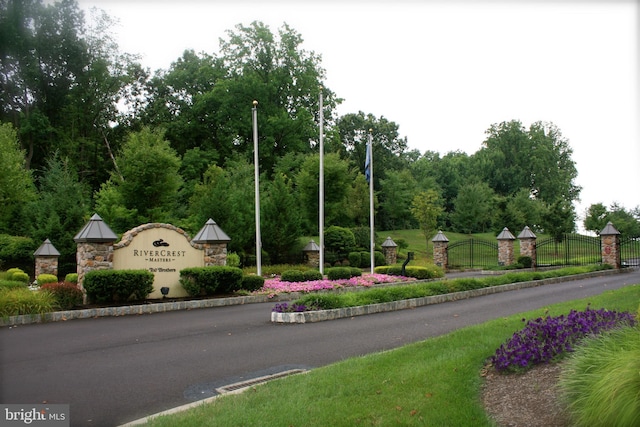 community sign featuring fence