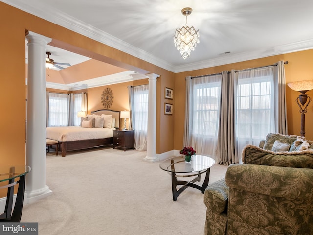 bedroom with carpet flooring, multiple windows, and decorative columns