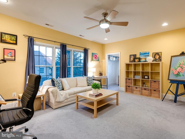 carpeted living room featuring recessed lighting, visible vents, and a ceiling fan