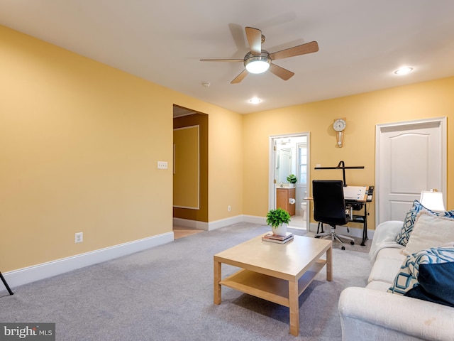 living room featuring light carpet, recessed lighting, baseboards, and a ceiling fan