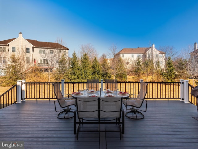 wooden deck featuring outdoor dining space