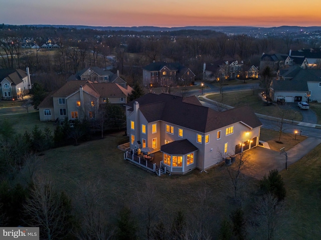 aerial view at dusk with a residential view