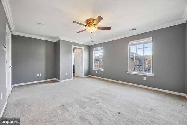 interior space with carpet, baseboards, visible vents, ceiling fan, and crown molding