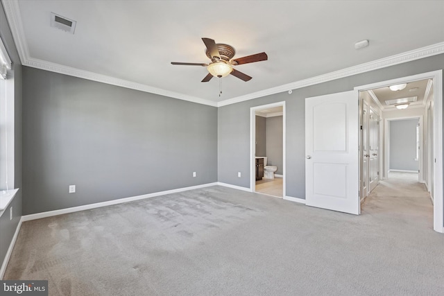 unfurnished bedroom with visible vents, baseboards, carpet flooring, and crown molding