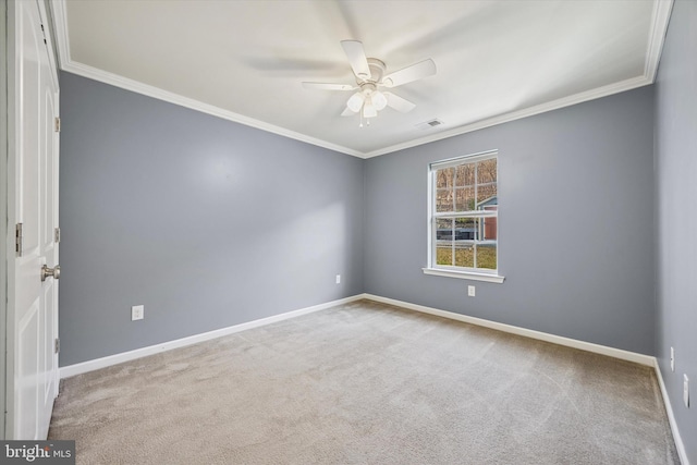 carpeted empty room featuring visible vents, baseboards, a ceiling fan, and crown molding