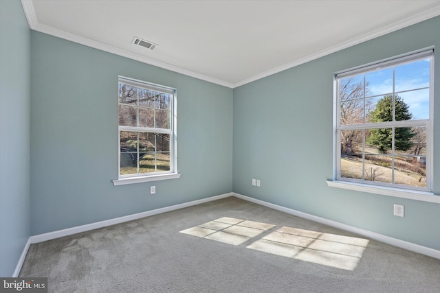 spare room featuring baseboards, visible vents, and carpet floors