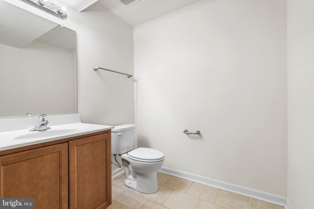 bathroom with vanity, visible vents, baseboards, tile patterned floors, and toilet