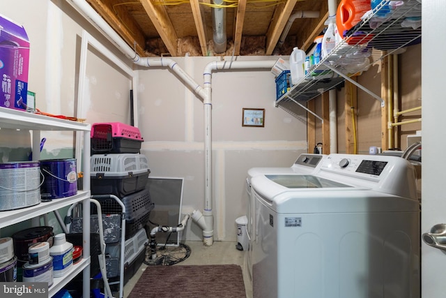 laundry room with separate washer and dryer and laundry area