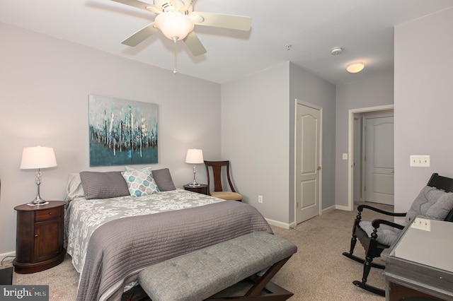 bedroom with a ceiling fan, light colored carpet, and baseboards