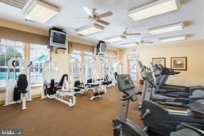 workout area featuring a ceiling fan