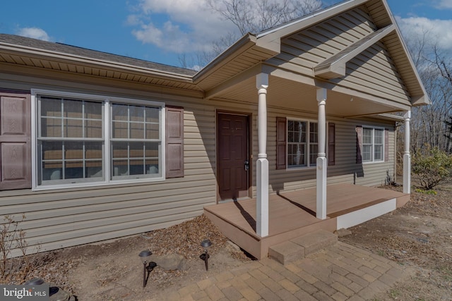 doorway to property featuring a porch