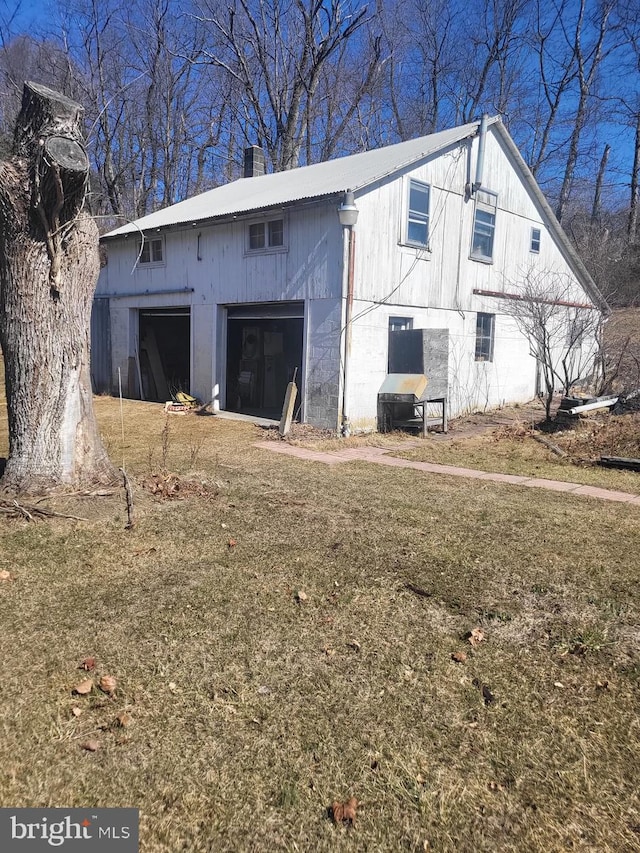 view of outdoor structure featuring an attached garage