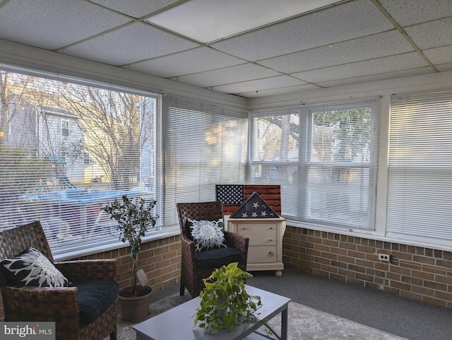 sunroom featuring a drop ceiling