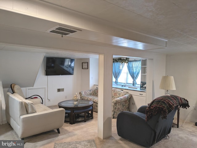 living room with visible vents and light colored carpet