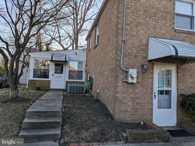 view of front of house featuring brick siding