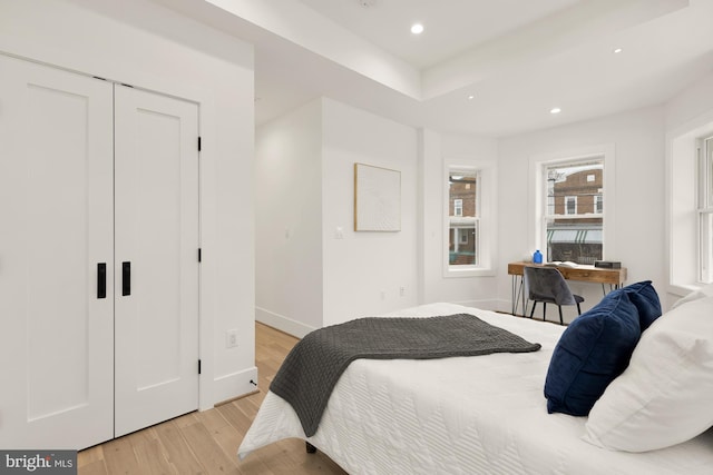 bedroom with recessed lighting, baseboards, and light wood-style flooring