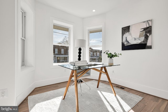 office area featuring wood finished floors and baseboards