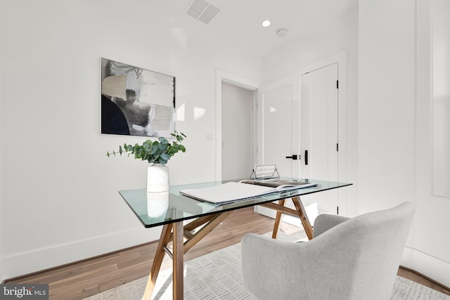 office with recessed lighting, visible vents, baseboards, and wood finished floors