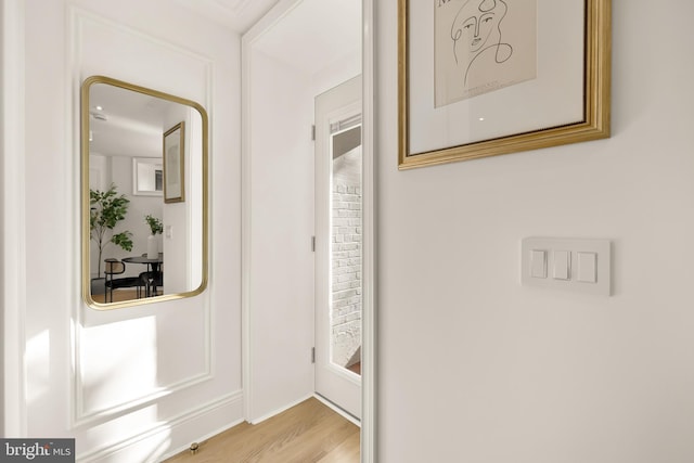 hallway with wood finished floors