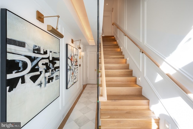 staircase with tile patterned floors