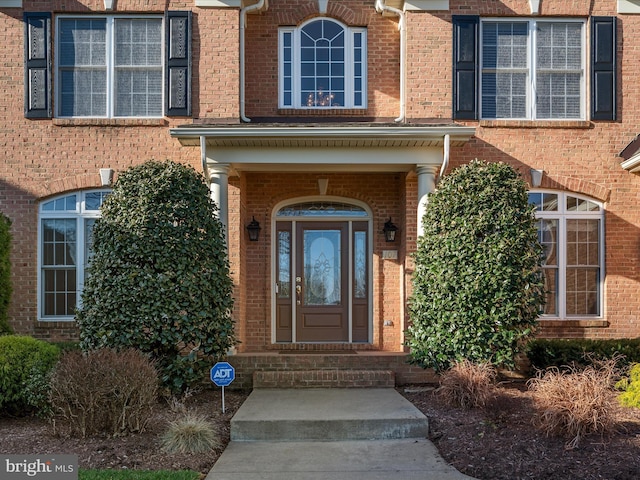 property entrance with brick siding