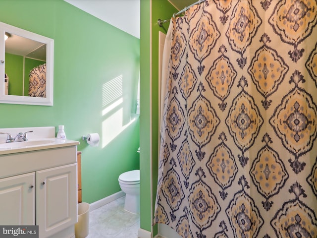 bathroom with a shower with shower curtain, toilet, vanity, and tile patterned flooring