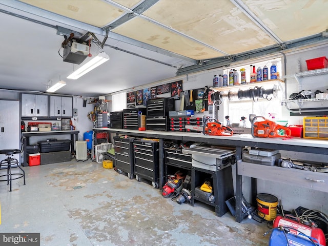 garage featuring a workshop area and a garage door opener