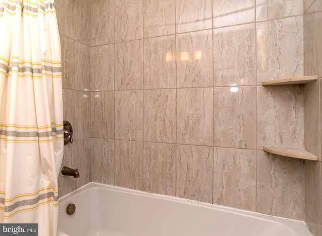 bathroom featuring shower / bath combination with curtain