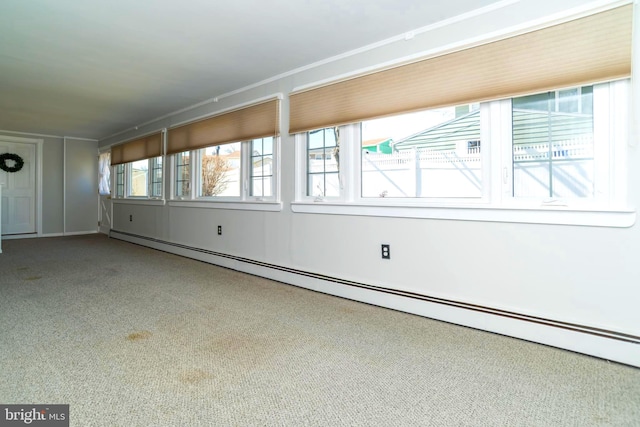 empty room featuring a baseboard heating unit