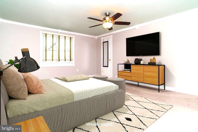 bedroom with ceiling fan, light carpet, and ornamental molding