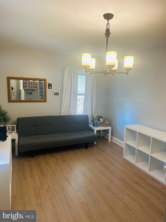 living room featuring baseboards and light wood-style floors