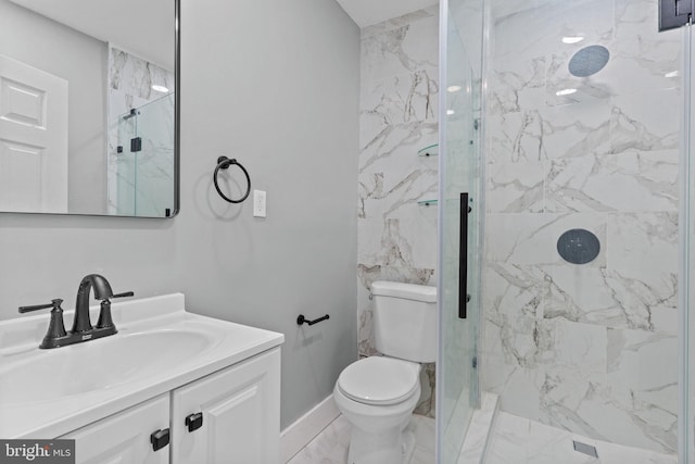 full bathroom with vanity, baseboards, a marble finish shower, toilet, and marble finish floor