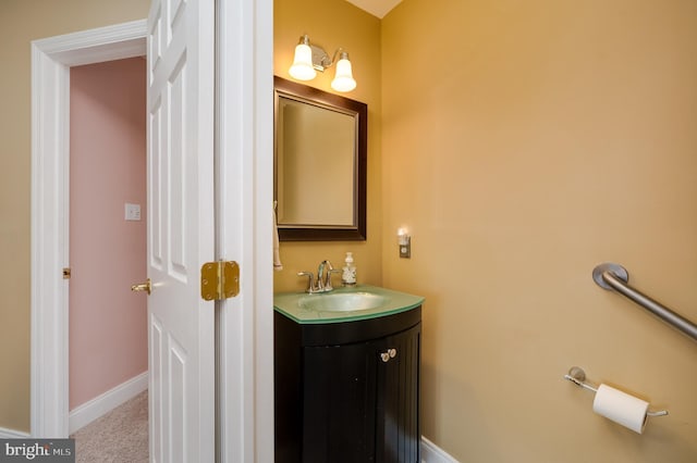 bathroom featuring vanity and baseboards