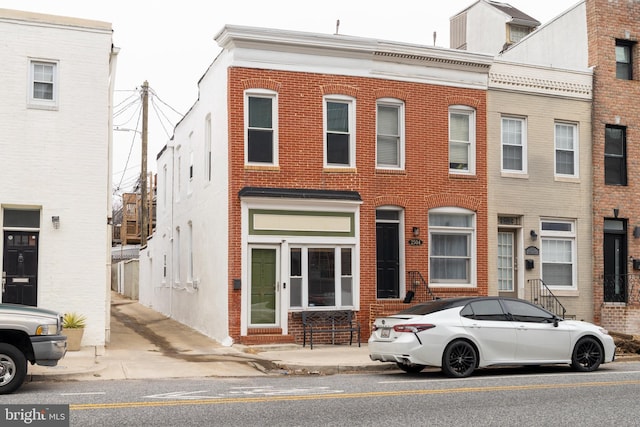 view of property with brick siding