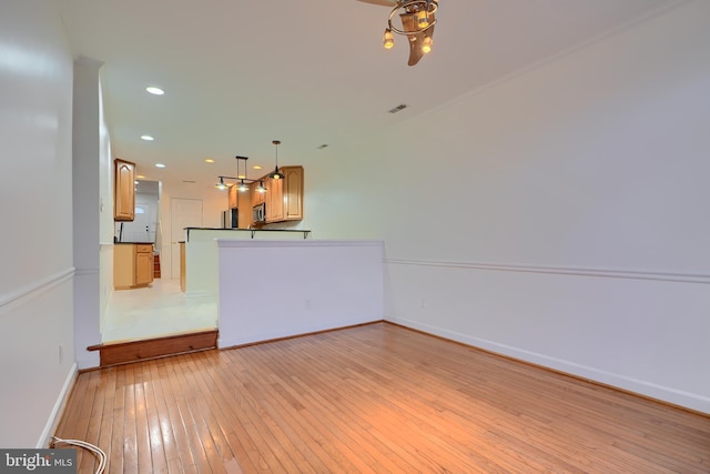 interior space featuring visible vents, recessed lighting, baseboards, and light wood-style floors