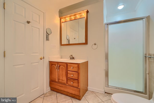 bathroom with vanity, a shower with shower door, tile patterned flooring, crown molding, and toilet