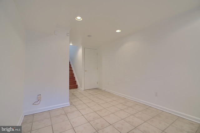 unfurnished room with light tile patterned floors, stairway, recessed lighting, and baseboards