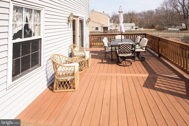 deck with outdoor dining area