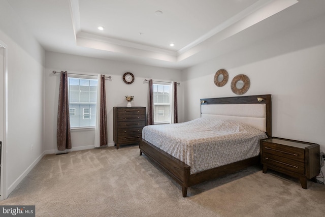 bedroom with recessed lighting, baseboards, a raised ceiling, and light carpet