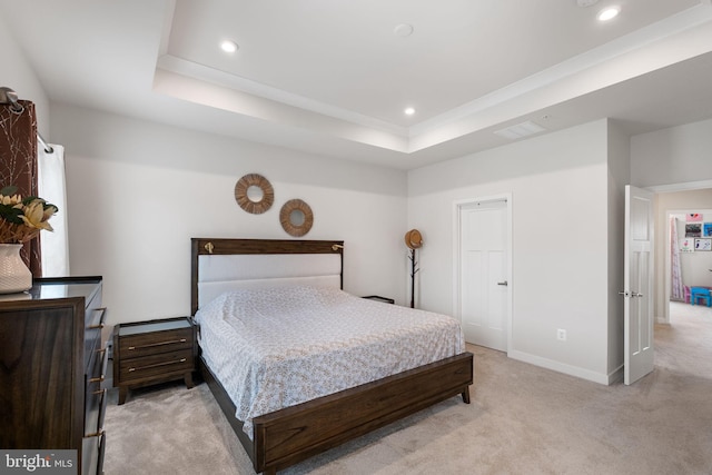 bedroom featuring visible vents, baseboards, light carpet, recessed lighting, and a raised ceiling