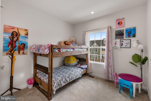 bedroom featuring carpet flooring, visible vents, and baseboards