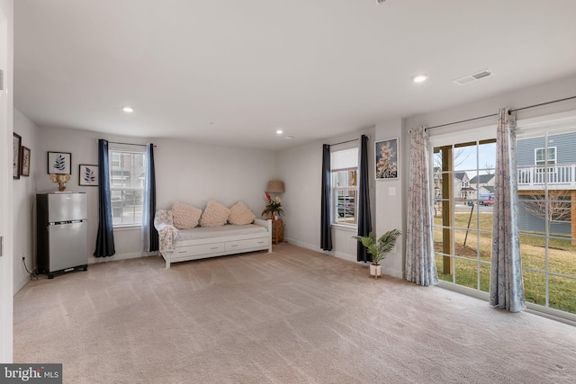 unfurnished room with recessed lighting, visible vents, baseboards, and light colored carpet