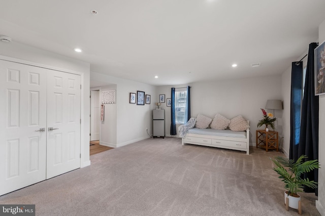 unfurnished bedroom with visible vents, recessed lighting, a closet, carpet floors, and baseboards