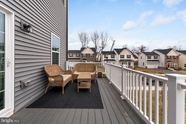 deck with a residential view and an outdoor hangout area